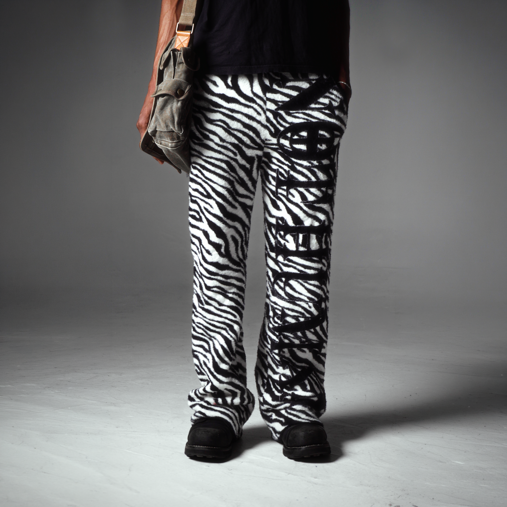 "NOT HUMAN" ZEBRA LOUNGE SWEATS